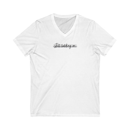 T-Shirt still holding on to the iron rod Unisex Jersey Short Sleeve V-Neck Tee
